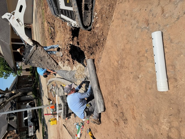 Apex crew installing drainage fabric and aggregate